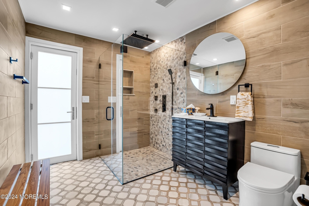 Spa Bath with Wood-Tile Walls